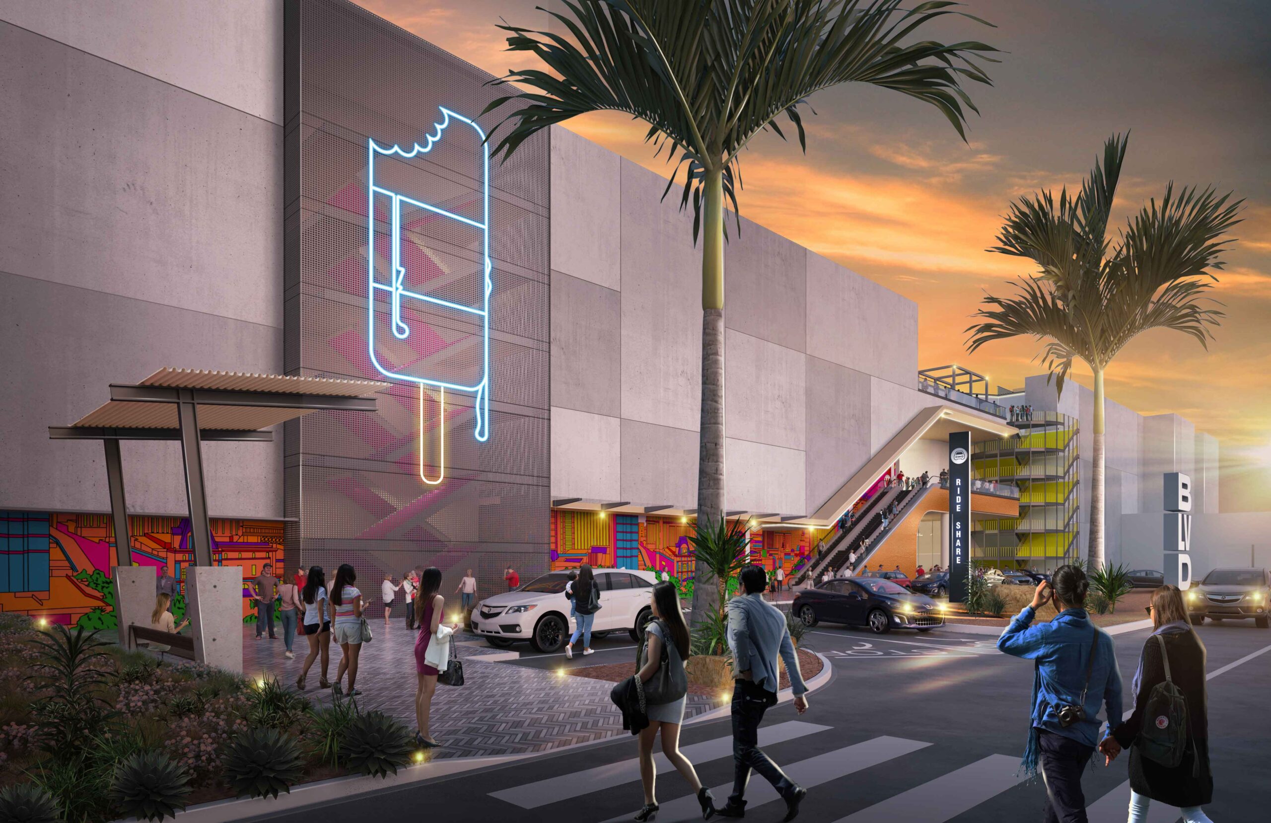 A street level view of a pedestrian crossing near a ride share pick-up/drop-off location next to the complex with an ice lolly neon sign on the wall.